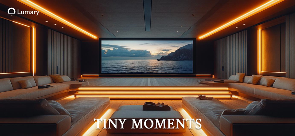 A home theatre with the words 'Tiny Moments' on the screen and use dimmable lights